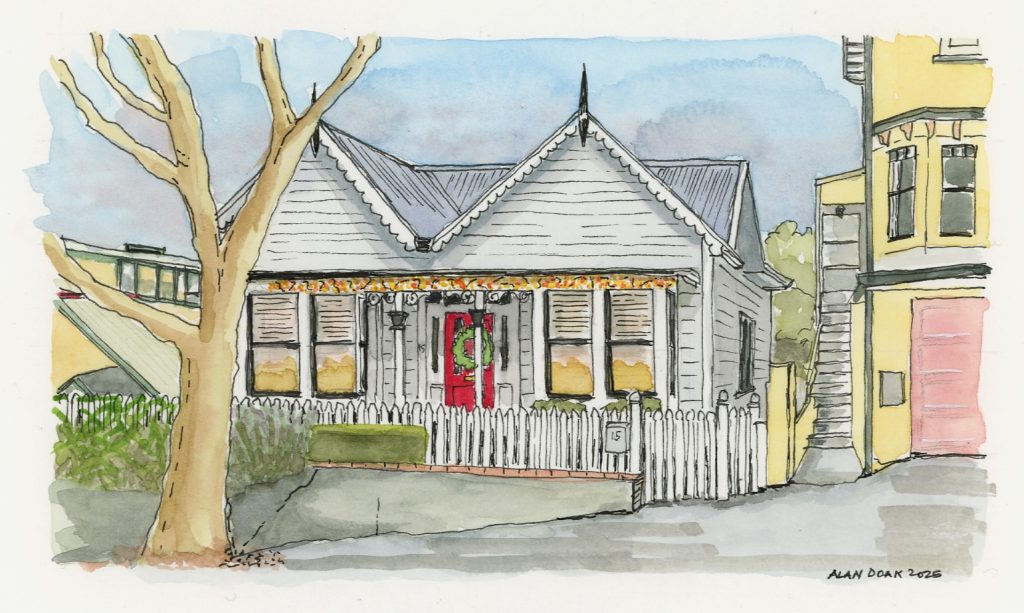 Turn of the 19th century villa in Thorndon, Wellington, New Zealand, with Christmas lights and a wreath on the front door.